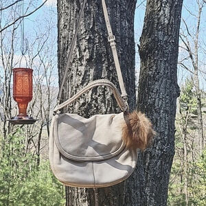 Cole Haan crossbody with fox pom